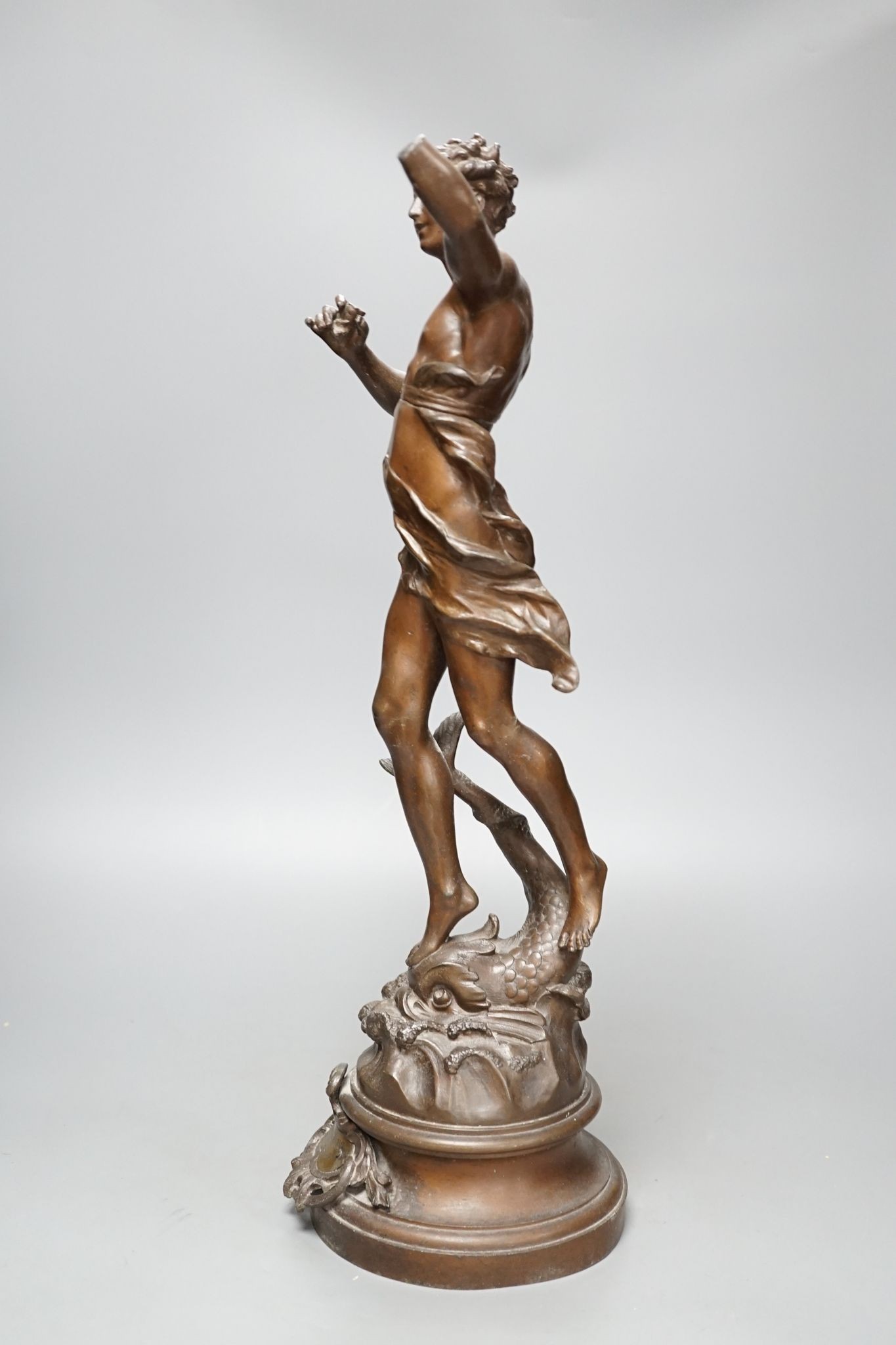 After Ferrand, a spelter figure of a gentleman upon a dolphin, plaque to base reading ‘Zephyr Marin Par Ferrand’, 50cm